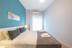 Postel nebo postele na pokoji v ubytování Pame Rentals - 2BD & 2BA Home, 4 Min to Acropolis