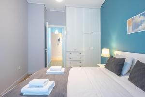 Postel nebo postele na pokoji v ubytování Pame Rentals - 2BD & 2BA Home, 4 Min to Acropolis