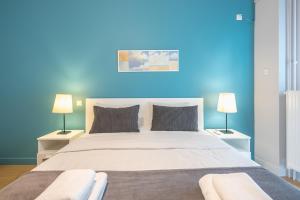 Postel nebo postele na pokoji v ubytování Pame Rentals - 2BD & 2BA Home, 4 Min to Acropolis