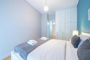 Postel nebo postele na pokoji v ubytování Pame Rentals - 2BD & 2BA Home, 4 Min to Acropolis