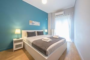 Postel nebo postele na pokoji v ubytování Pame Rentals - 2BD & 2BA Home, 4 Min to Acropolis