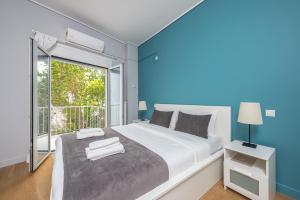 Postel nebo postele na pokoji v ubytování Pame Rentals - 2BD & 2BA Home, 4 Min to Acropolis