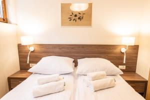Posteľ alebo postele v izbe v ubytovaní Apartamenty Leśne Zacisze