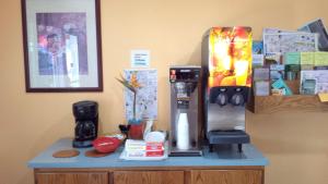 a counter with a coffee maker on top of it at Executive Inn & Suites in Lakeview