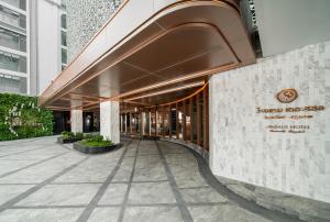 vista sulla hall dell'hotel Los Angeles di The Salil Hotel Riverside Bangkok a Bangkok