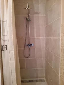 a bathroom with a shower with a shower curtain at Au coeur des Angles in Les Angles +56 photos