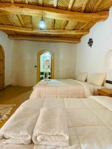 Postel nebo postele na pokoji v ubytování Riad Ecobio