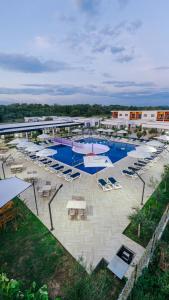 an aerial view of a resort with a pool and chairs at Family Resort in Ulcinj