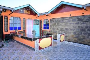 a bar in the front of a building at THE PINGS BNB in Narok