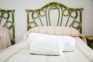 Letto o letti in una camera di Casa di Alice By Vivimy