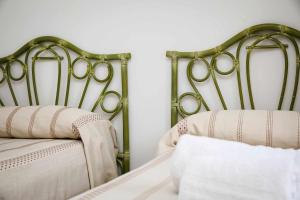 Letto o letti in una camera di Casa di Alice By Vivimy