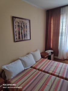 Postel nebo postele na pokoji v ubytování Homestay Kostadinov