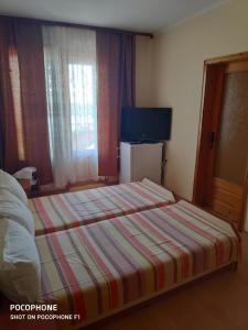 Postel nebo postele na pokoji v ubytování Homestay Kostadinov