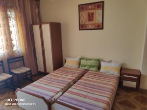 Postel nebo postele na pokoji v ubytování Homestay Kostadinov