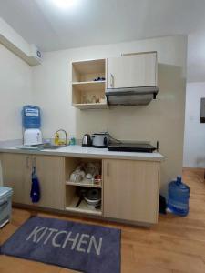 a kitchen with a sink and a counter top at Seawind Condo Tower 3,4,5,6 near Davao Airport in Davao City