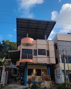 a large building with a dome on top of it at R & R (Rest & Relax) Guesthouse in Siquijor