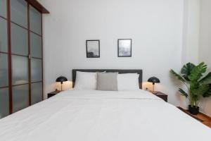 Ένα ή περισσότερα κρεβάτια σε δωμάτιο στο Houseloft CityView Hagia Sophia