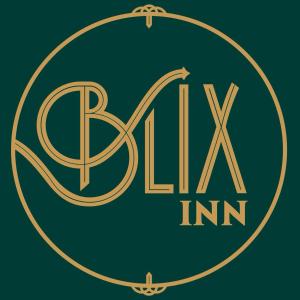 a gold logo with the words alpha inn at Blix in Stellenbosch