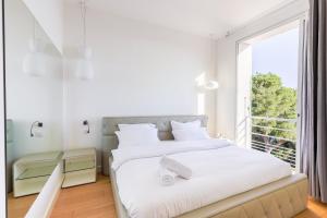 Postel nebo postele na pokoji v ubytování Villa Élégante Nice avec Vue Mer