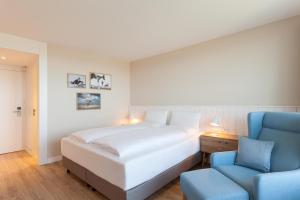 Ένα ή περισσότερα κρεβάτια σε δωμάτιο στο Wyn. Strandhotel Sylt