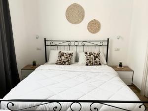 Een bed of bedden in een kamer bij Marina Casa Vacanza