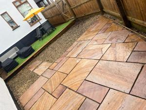 an overhead view of a wooden patio with an umbrella at The Annex in Bristol