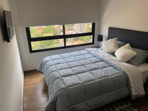 Postel nebo postele na pokoji v ubytování Depto de lujo en zona Carmelitas + 33 fotografií