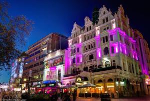 a building with purple lights on the side of it at Large Luxurious CENTRAL Private Terrace - For 6 in London