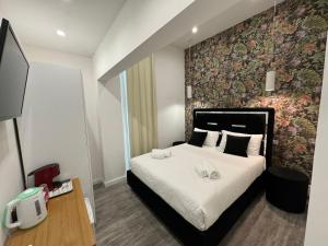 A bed or beds in a room at Eden LUXURY ROMA