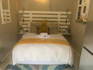 Postel nebo postele na pokoji v ubytování Meraki Upmarket Guesthouse