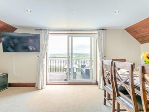 a room with a sliding glass door with a balcony at 4 Bed in Barnstaple ELLER in Fremington