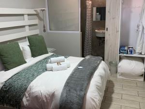 Postel nebo postele na pokoji v ubytování Meraki Upmarket Guesthouse