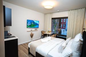 a hotel room with a bed and a window at Boutique Apartment 3 Oberhausen in Oberhausen