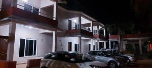 a group of cars parked in front of a building at Deva Samudra Beach Stay in Gokarna