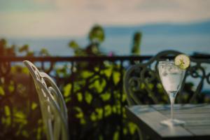 a table with a wine glass with a lemon on it at Luna Kaş in Kaş