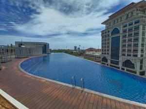 a large swimming pool on top of a building at The Penthouse TROIKA KOTA BHARU in Kota Bharu