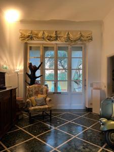 a living room with a chair and a window at artemare in Viareggio +54 photos