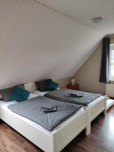 Postel nebo postele na pokoji v ubytování Ferienhaus "Zur Mühle"