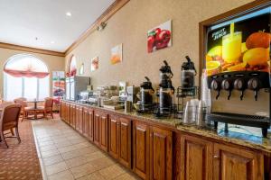 a restaurant with a counter with a coffee station at Quality Inn Alliance in Alliance