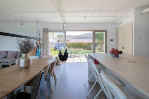 A seating area at A Factoria Beach House by Prishomes