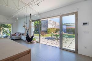 A seating area at A Factoria Beach House by Prishomes