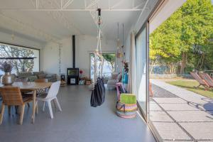A balcony or terrace at A Factoria Beach House by Prishomes