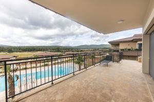 a view from the balcony of a house with a swimming pool at Luxury Villa w Pool Balcony in Regnum Golf Club in Çamlık