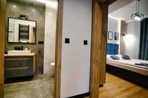 Łóżko lub łóżka w pokoju w obiekcie Apartament No 61 Blue Holiday Home Zator