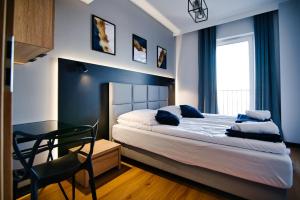 Łóżko lub łóżka w pokoju w obiekcie Apartament No 61 Blue Holiday Home Zator