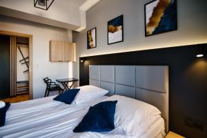 Łóżko lub łóżka w pokoju w obiekcie Apartament No 61 Blue Holiday Home Zator