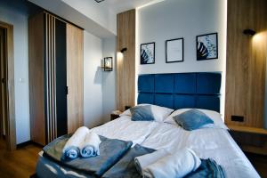 Łóżko lub łóżka w pokoju w obiekcie Apartament No 61 Blue Holiday Home Zator