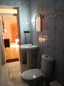 a bathroom with a toilet and a sink at Family house 2 bedrooms, 2 sdb, near Center of Nador & Airport in Selouane