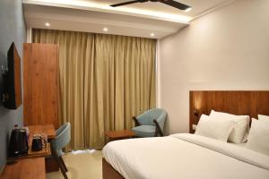 Ένα ή περισσότερα κρεβάτια σε δωμάτιο στο Arjun - A boutique hotel