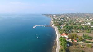 an aerial view of a bay with boats in the water at Coastal SeaCharm - Theotokos Sandyfill Getaway in Nerotriviá